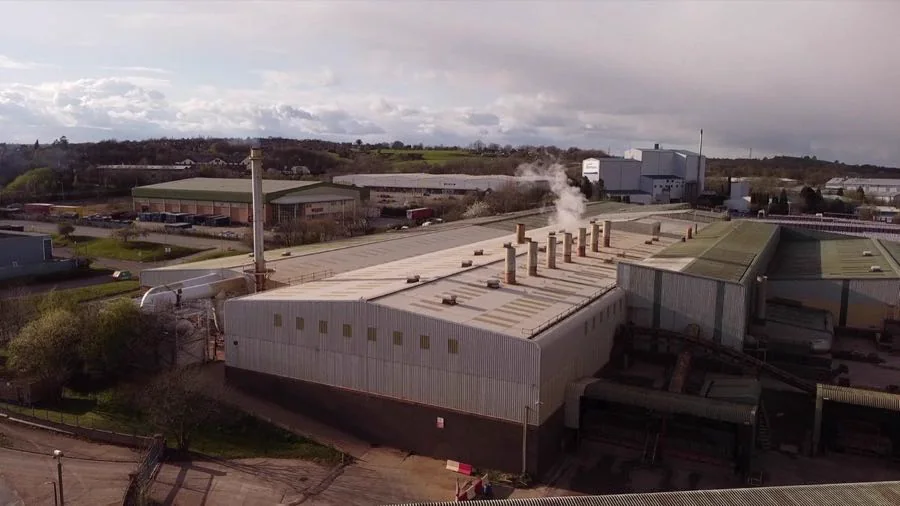 Industrial smokestacks emitting steam at an energy facility